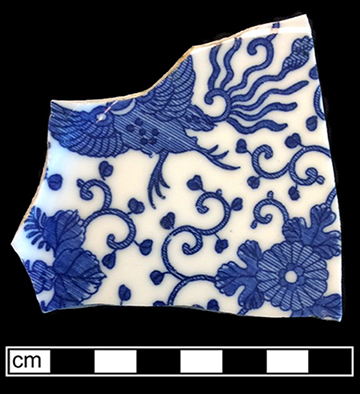 Japanese porcelain printed underglaze in blue on plate in Phoenix Bird pattern.  Printed &ldquo;Made in Japan&rdquo; on reverse. Ross (2012:18) dates  the earliest print reference to this pattern to 1914, with simultaneous appearance in North America.